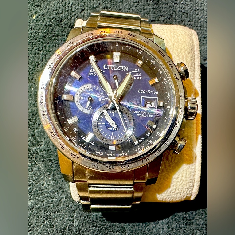 Citizens World Controlled Time Eco-Drive watch. Blue face
